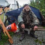 Eugene Graham, who calls himself the Traveler, talks about living in a homeless encampment on property belonging to the Alaska Mental Health Trust Authority on Friday, Aug. 18, 2017. The Trust Authority will give campers a two-week notice to vacate the area starting Tuesday. (Michael Penn | Juneau Empire)
