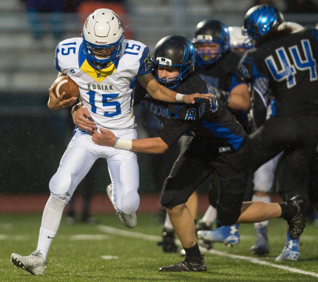 Thunder Mountain&rsquo;s Gaven Smith sacks Kodiak&rsquo;s quarterback Dosey Berry at TMHS on Friday, Aug. 18, 2017. TMHS won 14-7. (Michael Penn | Juneau Empire)