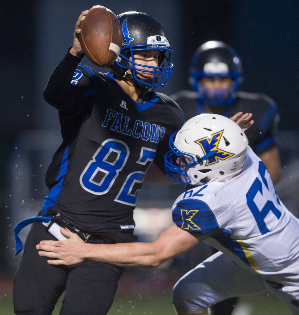 Thunder Mountain&rsquo;s quarterback Owen Mendoza is sacked by Kodiak&rsquo;s Mica Hartel at TMHS on Friday, Aug. 18, 2017. TMHS won 14-7. (Michael Penn | Juneau Empire)