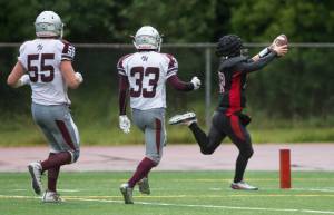 Juneau-Douglas&rsquo; Bubba Stults runs for a touchdown against Ketchikan after making an interception at Adair-Kennedy Memorial Field on Saturday, Aug. 19, 2017. JDHS won 32-8. (Michael Penn | Juneau Empire)