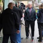 Lindsay Walker Hobson, daughter to Gov. Bill Walker, left, watches as media members interview the Governor and Lt. Gov. Byron Mallott after filing for re-election at the state&rsquo;s election office in Juneau on Monday, Aug. 21, 2017.
