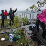 Juneau Police Department Officer Alex Smith tours homeless encampments on Alaska Mental Health Trust Authority land on Tuesday, Aug. 22, 2017. (Michael Penn | Juneau Empire)