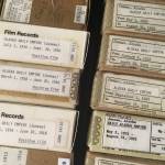 Boxes of microfilm containing back issues of the Alaska Daily Empire, predecessor to the Juneau Empire, are seen in a cabinet Friday, Aug. 25, 2017 at the Alaska State Library. The library, with funding from the National Endowment for the Humanities and the Library of Congress, is digitizing the Empire&rsquo;s predecessors through the end of 1922, alongside several other pioneering Alaska newspapers. (James Brooks | Juneau Empire)