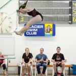 Judges watch a diver perform her routine during the swim meet Saturday at the Augustus Brown Swimming Pool. (Konrad Frank | For the Juneau Empire)