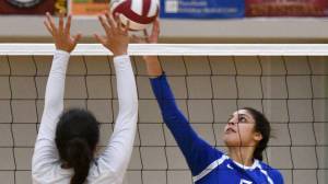 Thunder Mountain High School&rsquo;s Maxie Saceda-Hurt tips the ball over the net, Friday, Sept. 8, 2017, during the Falcons&rsquo; 3-0 win against Ketchikan High School in the Clarke Cochrane Gym. The Falcons rematched the Kings on Saturday night. (Taylor Balkom | Ketchikan Daily News)