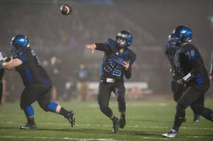 In this Sept. 1 photo, Thunder Mountain&rsquo;s quarterback Owen Mendoza throws in overtime against Juneau-Douglas at TMHS. Thunder Mountain won 10-7 in overtime. (Michael Penn | Juneau Empire File)