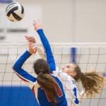Thunder Mountain&rsquo;s Lilyan Smith tips the ball over against Sitka&rsquo;s Hadley Andersen at Thunder Mountain High School on Friday, Sept. 15, 2017. (Michael Penn | Juneau Empire)