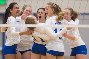 Thunder Mountain&rsquo;s Audrey Welling celebrates a kill shot with her teammates during their match against Sitka on Friday at Thunder Mountain High School on Friday, Sept. 15, 2017. (Michael Penn | Juneau Empire)