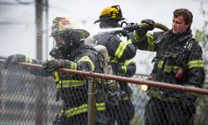 Capital City Fire/Rescue cleans up after fighting a fire at 526 Seward Street, next to the Terry Miller Legislative Building, on Sunday, Sept. 17, 2017.