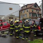 Capital City Fire/Rescue cleans up after fighting a fire at 526 Seward Street, next to the Terry Miller Legislative Building, on Sunday, Sept. 17, 2017.