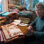 Odette Edgar talks about the handmade quilts she helped make and organize for the Housing First residents at her house on Tuesday, Sept. 26, 2017. (Michael Penn | Juneau Empire)