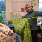 Odette Edgar talks about the handmade quilts she helped make and organize for the Housing First residents at her house on Tuesday, Sept. 26, 2017. (Michael Penn | Juneau Empire)