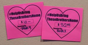 Cards displayed at McGivney&rsquo;s Sports Bar & Grill in the Mendenhall Valley on Tuesday, Sept. 26, 2017, show money given to a fundraising drive to sent the bodies of two brothers killed in a downtown fire last week back to their family in Mexico. (Michael Penn | Juneau Empire)