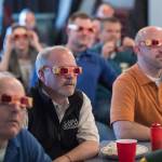 Attendees of the Juneau Chamber of Commerce luncheon don &ldquo;rose-colored glasses&rdquo; to view economic data presented by Brian Holst, executive director of the Juneau Economic Development Council at the Moose Lodge on Thursday, Sept. 28, 2017. (Michael Penn | Juneau Empire)