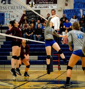 Thunder Mountain&rsquo;s Mary Landes, right, and Autumn Yeisley, left, of Ketchikan face off at the net during their game Friday at TMHS. The Falcons won in straight sets, 3-0. (Lance Nesbitt | For the Juneau Empire)