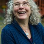 Nell McConahey at her Juneau home talks on Thursday, Oct. 5, 2017 about her winning Casablanca lily at the Alaska State Fair in Palmer. (Michael Penn | Juneau Empire)