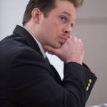 Christopher Strawn watches Juneau Assistant District Attorney Amy Paige question a witness at his trial in Juneau Superior Court on Friday, Oct. 6, 2017. Strawn, 34, faces charges of first-degree and second-degree murder, manslaughter, criminally negligent homicide, third-degree assault and weapons misconduct in the shooting death of Brandon Cook in October 2015. (Michael Penn | Juneau Empire)