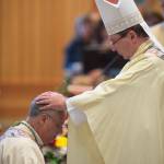 The Most Reverend Christophe Pierre, Apostolic Nuncio to the United States, right, performs the laying-on of hands during the ordination of Bishop Andrew E. Bellisario as the Sixth Bishop of the Diocese of Juneau at St. Paul the Apostle Catholic Church on Tuesday, Oct. 10, 2017. (Michael Penn | Juneau Empire)