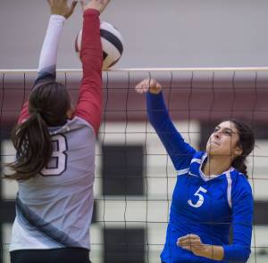 Thunder Mountain&rsquo;s Maxie Saceda-Hurt, right, has her spike blocked by Wrangell&rsquo;s Anna Allen at the Juneau Invitational Volleyball Extravaganza at JDHS on Friday, Oct. 13, 2017. (Michael Penn | Juneau Empire)