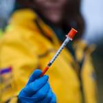 Leticia McRae shows a discarded syringe she pick up while collecting garbage near Sunny Point on Wednesday, Oct. 18, 2017. (Michael Penn | Juneau Empire)