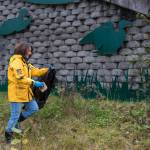 Leticia McRae picks up garbage near Sunny Point on Wednesday, Oct. 18, 2017. (Michael Penn | Juneau Empire)