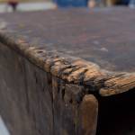 Damage to a wooden box drum that is currently undergoing restoration at Sealaska Heritage Institute on Wednesday, Oct. 18, 2017. The drum, which is from the T&rsquo;akdeintaan clan of Hoonah, was repatriated in 2011 and is believed to have belonged to a shaman. (Michael Penn | Capital City Weekly)