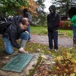 The gravesite of Hi Chung, also known as &ldquo;China Joe&rdquo;, during a tour of Evergreen Cemetery by as part of an intensive course on Alaskan history for Yaa&