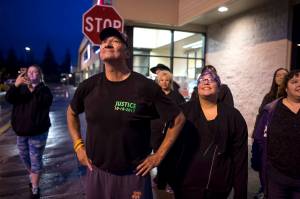 Don Cook, father of Brandon Cook, who was murdered in 2015, watches balloons they released with friends and family to honor his son in front of Safeway on Friday, Oct. 20, 2017. Cook and his wife, Amanda, flew up from Wewoka, Oklahoma, this week to witness the trial of Christopher Strawn, 34. On Wednesday, the jury took just three and a half hours to reach a decision guilty on charges of first-degree. (Michael Penn | Juneau Empire)