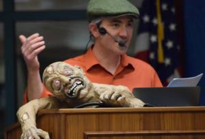 Dr. Sol Neely lectures at an Evening at Egan talk about zombies at the University of Alaska Southeast on Friday, Oct. 20. (Kevin Gullufsen | Juneau Empire)