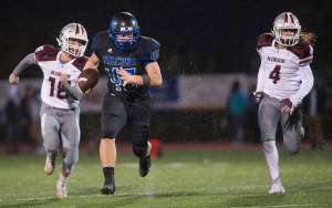 Thunder Mountain&rsquo;s Puna Touteiolepo sacks Juneau-Douglas&rsquo; Max Wheat in a game this September. Touteiolepo was named Division II First-Team All-State by the Alaska Football Coaches Association. Touteiolepo was also named the Southeast Conference defensive player of the year. Teammates Derek Boord, Ivan Williams and Jacob Babcock also made Division II first-team all-state. (Michael Penn | Juneau Empire)