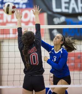 Thunder Mountain&rsquo;s Gabriella Sloan spikes the ball against Juneau-Douglas&rsquo; Jessica Pierce at JDHS on Friday, Oct. 27, 2017. Thunder Mountain won 16-14 in the tie-breaking fifth game. (Michael Penn | Juneau Empire)