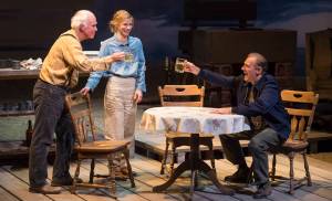 John Barrymore, played by Peter DeLaurier, right, introduces himself to Joe, played by Mike Peterson, left, and Muz, played by Shelley Virginia, during Perseverance Theatre&rsquo;s production of Joel Bennett&rsquo;s &ldquo;Dreaming Glacier Bay&rdquo; on Tuesday, Oct. 25, 2017. (Michael Penn | Capital City Weekly)