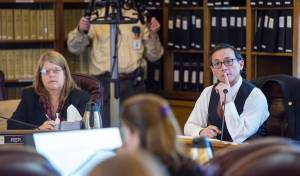 Rep. Tammie Wilson, R-North Pole, left, and Rep. Scott Kawasaki, D-Fairbanks, listen to Suzanne DiPietro, Executive Director of the Alaska Judicial Council, as the House Finance Committee meets on how to pay for SB54, a criminal justice bill, at the Capitol on Wednesday, Nov. 1, 2017. (Michael Penn | Juneau Empire)