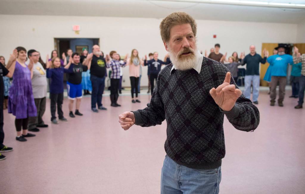 Front: Michael Wittig Sr. Back: Tsifira Kiehl, Sabrina Duncan, Kyra Wood, Matthew Talley, George Watt, Michael Wittig Jr., Sadie Jenkins, Mikayla Neal, James Deatsm Dannan Mills, David Brooks and Greg Germain. Rehearsal of Latitude 58&rsquo;s production of &ldquo;Fiddler on the Roof&rdquo; at St. Ann&rsquo;s Hall on Thursday, Nov. 9, 2017. (Michael Penn | Capital City Weekly)