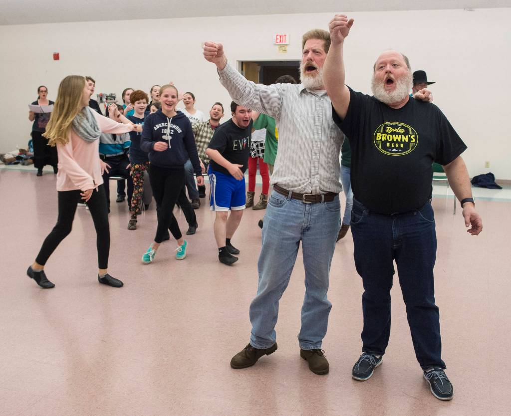 Front: Michael Wittig Sr., and George Watt. Back: Sadie Jenkins, Matthew Talley, Karen Adkison, Reagan Mitchell, Andrew Bogar, Madeline Germain, and Grace Hudson. Rehearsal of Latitude 58&rsquo;s production of &ldquo;Fiddler on the Roof&rdquo; at St. Ann&rsquo;s Hall on Thursday, Nov. 9, 2017. (Michael Penn | Capital City Weekly)