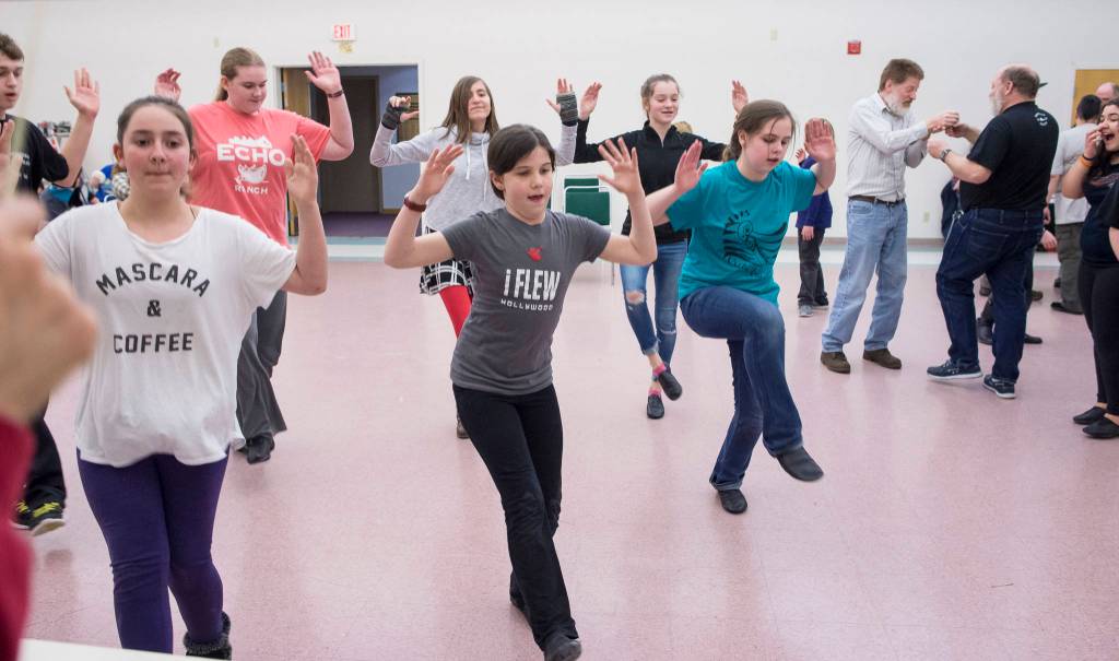 Left to right: Blake Terry, Regan Mitchell, Katlyn Fergusson, Nakenna Kotlarov, Doir Germain, Grace Hudson, Madeline Germain, Michael Wittig Sr., George Watt, and Elena Truitt. Rehearsal of Latitude 58&rsquo;s production of &ldquo;Fiddler on the Roof&rdquo; at St. Ann&rsquo;s Hall on Thursday, Nov. 9, 2017. (Michael Penn | Capital City Weekly)