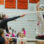 Juneau-Douglas High School senior middle blocker Cassie Dzinich delivers a kill in the Crimson Bears&rsquo; 3-0 win over the Wasilla Warriors on Friday morning. (Nolin Ainsworth | Juneau Empire)