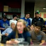 Thunder Mountain High School football coaching staff and players wait for their turn to give public testimony surrounding the consolidation of Juneau&rsquo;s football teams under Juneau-Douglas High School, Wednesday, Nov. 14, 2017, in the JDHS Library. Coaches, players and TMHS student government members spoke in favor of establishing a program under a new name and colors. (Nolin Ainsworth | Juneau Empire)