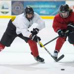 Cully Corrigan, left, passes away from Bill Bosse, right, with Joseph Monsef in the background during Juneau-Douglas High School hockey practice at the Treadwell Arena on Thursday, Nov. 16, 2017. (Michael Penn | Juneau Empire)