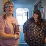 Gina Frickey, left, and Sabrina Cardinal, a service coordinator for REACH, talk about new assistive technology being used in Frickey&rsquo;s home to help her stay safe. (Michael Penn | Juneau Empire)