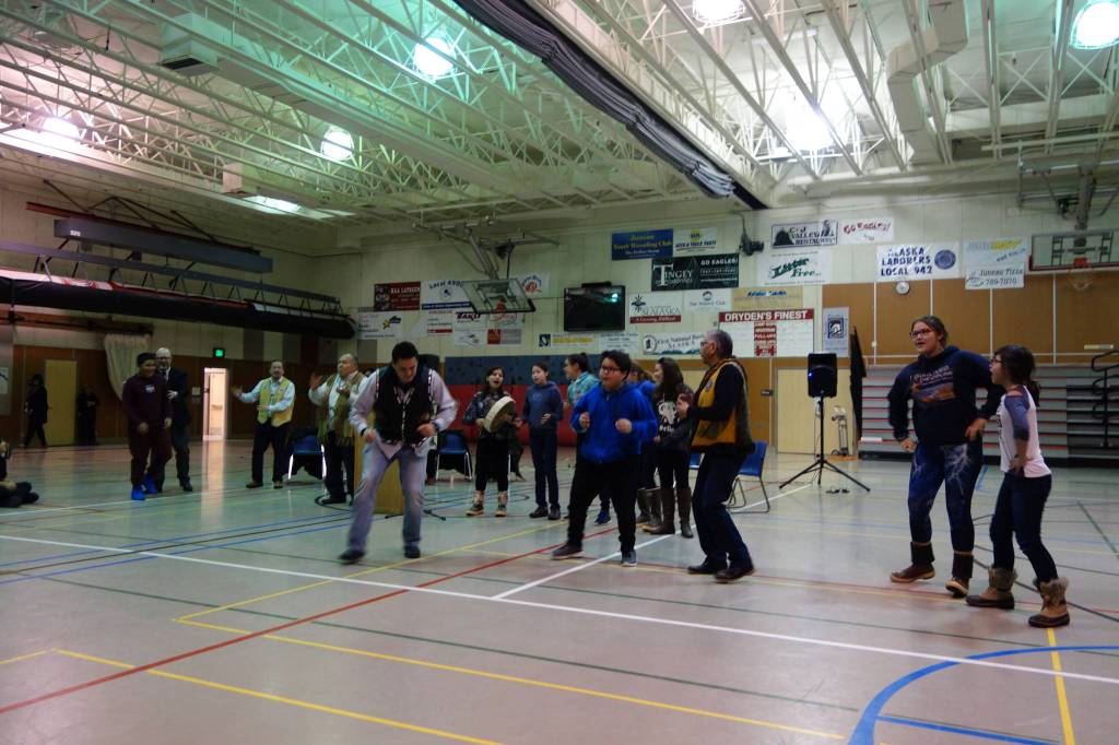 Floyd Dryden Middle School students sing Tlingit song about respecting elders and community members as other students, speakers, and teachers begin to participate at the &ldquo;Transfer of Core Cultural Values Panels Ceremony&rdquo; at Floyd Dryden Middle School on Wednesday, Nov. 22. (Clara Miller | Capital City Weekly)