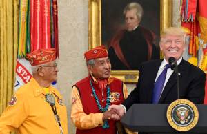 President Donald Trump, right, meets with Navajo Code Talkers Peter MacDonald, center, and Thomas Begay, left, in the Oval Office of the White House in Washington, Monday, Nov. 27, 2017. (Susan Walsh | The Associated Press)