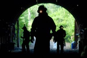 Miners in the Alaska Department of Labor and Workforce Development&rsquo;s Entry Level Underground Mining Training program walk into the AJ Mine at the Sheep Creek entrance in June 2010. (Michael Penn | Juneau Empire)