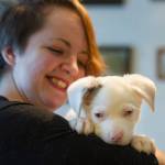 Briana Brint, president of Southeast Alaska Organization for Animals, holds Sid who is blind and deaf at a animal foster home in Juneau on Thursday, Nov. 30, 2017. Sid is from a litter rescued from Prince of Wales by the organization. (Michael Penn | Juneau Empire)