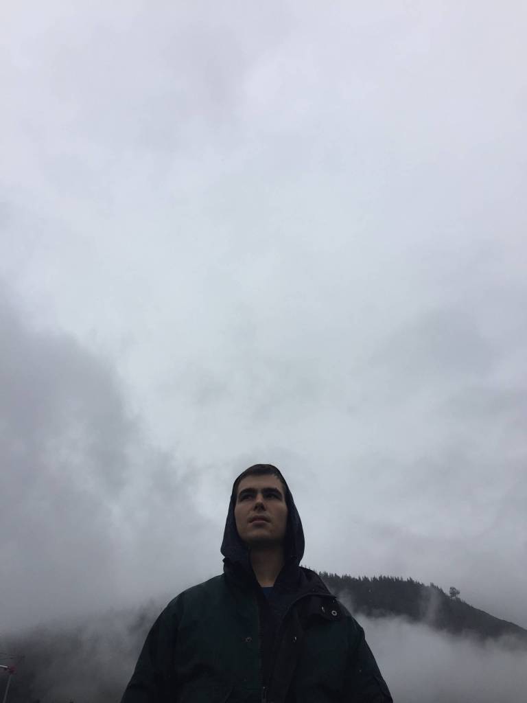 Nick Banaszak of Juneau stands outside of KTOO radio station after going on the air to talk about his band, Dankrupt, and their upcoming Juneau concert. (Photo by Grant Bogey of Dankrupt)