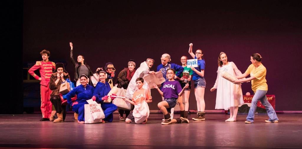 Underdressed locals and overdressed tourists pose at the end of their scene. Photo by Bobbi Jordan.