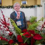 Lt. Gov. Byron Mallott laughs while sampling a cookie before the Governor&rsquo;s Open House on Tuesday, Dec. 5, 2017. (Michael Penn | Juneau Empire)