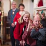 Gov. Bill Walker and his wife, Donna, gets a greeting from Henry Olmstead as he arrives for the Governor&rsquo;s Open House on Tuesday, Dec. 5, 2017. Lt. Gov. Byron Mallott and his wife, Toni, were also there for the annual opening. (Michael Penn | Juneau Empire)