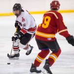 Juneau-Douglas&rsquo; Erik Genitz, left, moves the puck against a West Valley player at Treadwell Arena on Thursday, Nov. 30, 2017. (Michael Penn | Juneau Empire)