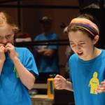 Two competitors in the Juneau Robot Jamboree react to an uncooperative robot at Centennial Hall Convention Center on Saturday. (Kevin Gullufsen | Juneau Empire)